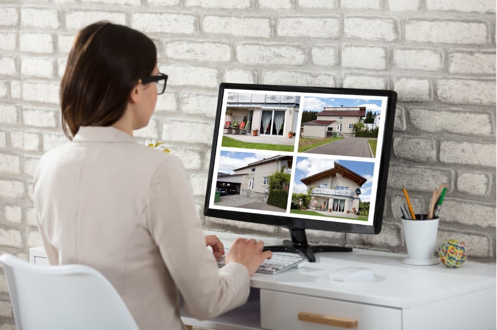 Host setting up a short-term rental listing on a computer