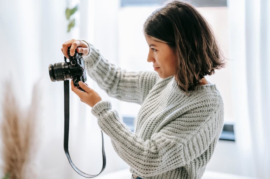 Photographer reviewing listing photos on a camera